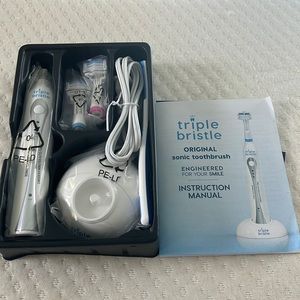 Sonic triple bristle toothbrush, new in box